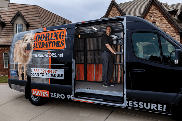 Team member in van | Flooring Liquidators Franchise